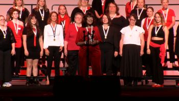 Photo of chorus accepting 3rd place award at International Contest 2025